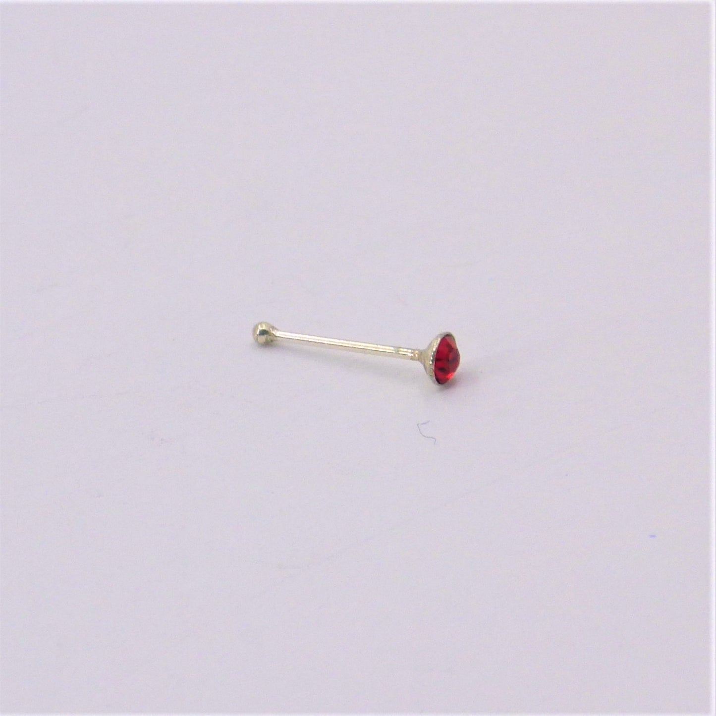 Silver nose-pins coloured